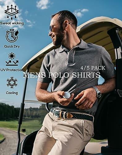 Man in a grey polo shirt standing by a golf cart holding a golf ball.