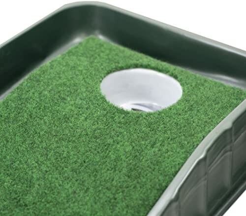 Portable golf putting mat with hole.